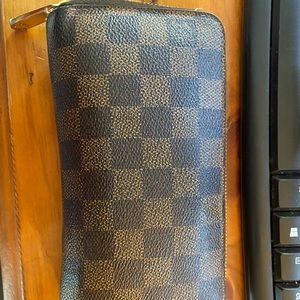 Authentic Louis Vuitton wallet. Minor wear from use, see photos.